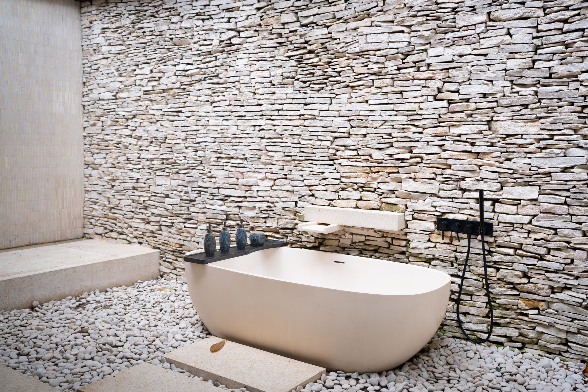 The open air bathroom inside one of the Beach Suites at Cap Karoso resort in Sumba, Indonesia