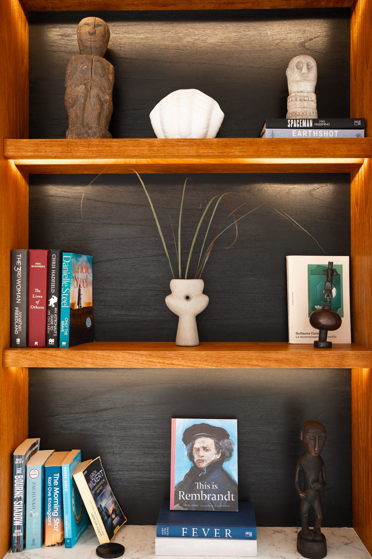 A bookshelf inside one of the beach suites at Cap Karoso resort in Sumba, Indonesia
