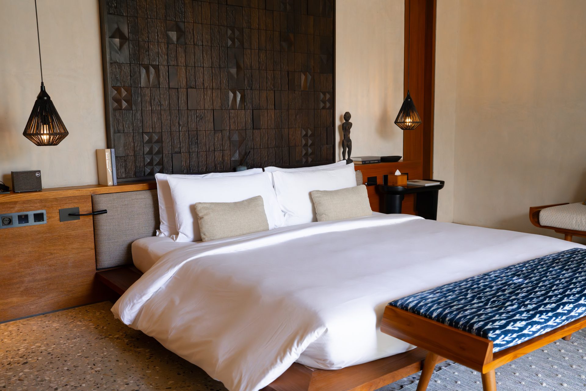 A California king size bed inside one of the Terrace Studios at Cap Karoso resort in Sumba, Indonesia