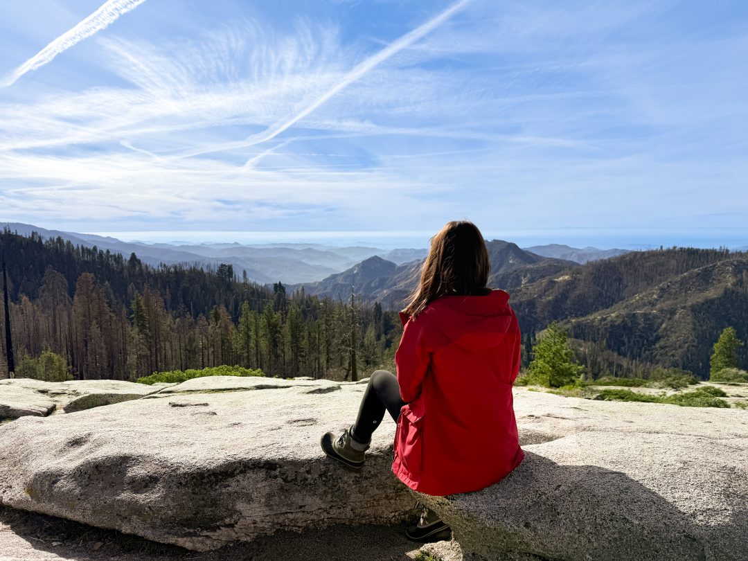 Travel Blogger Jordan Gassner looking out from Beetle Rock in Sequoia National Park