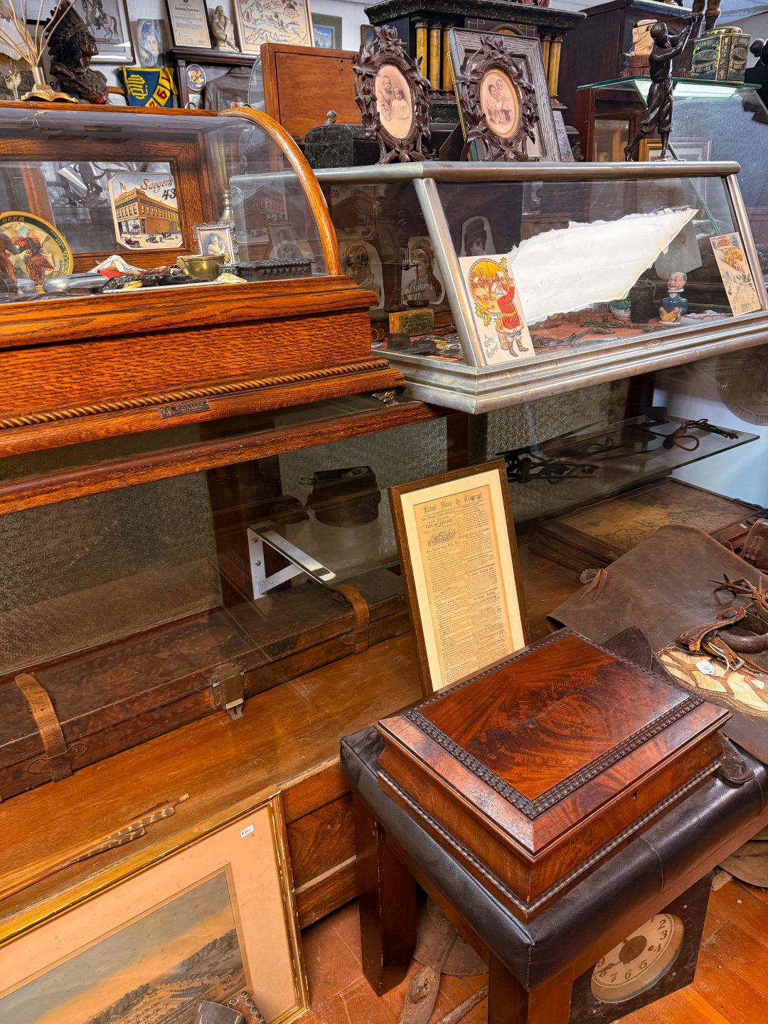 Vintage clocks and photographs inside Village Antiques in Three Rivers, California