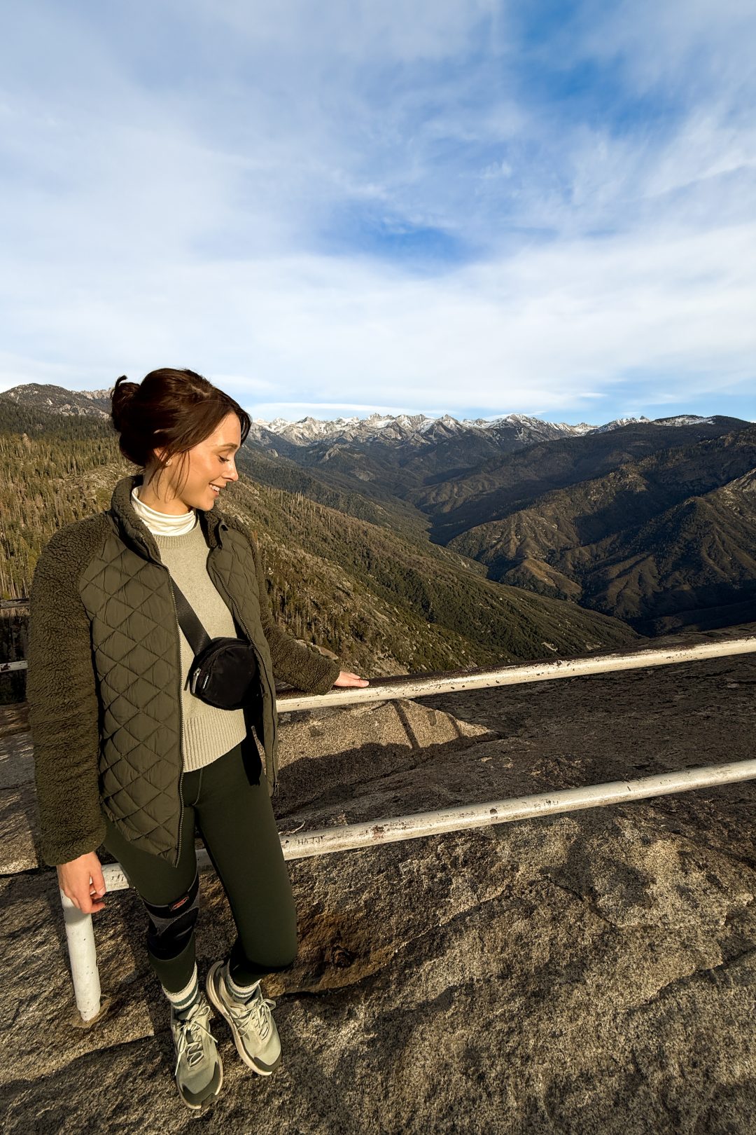 Travel Blogger Jordan Gassner smiling from the lookout point on top of Moro Rock during a Sequoia National Park trip