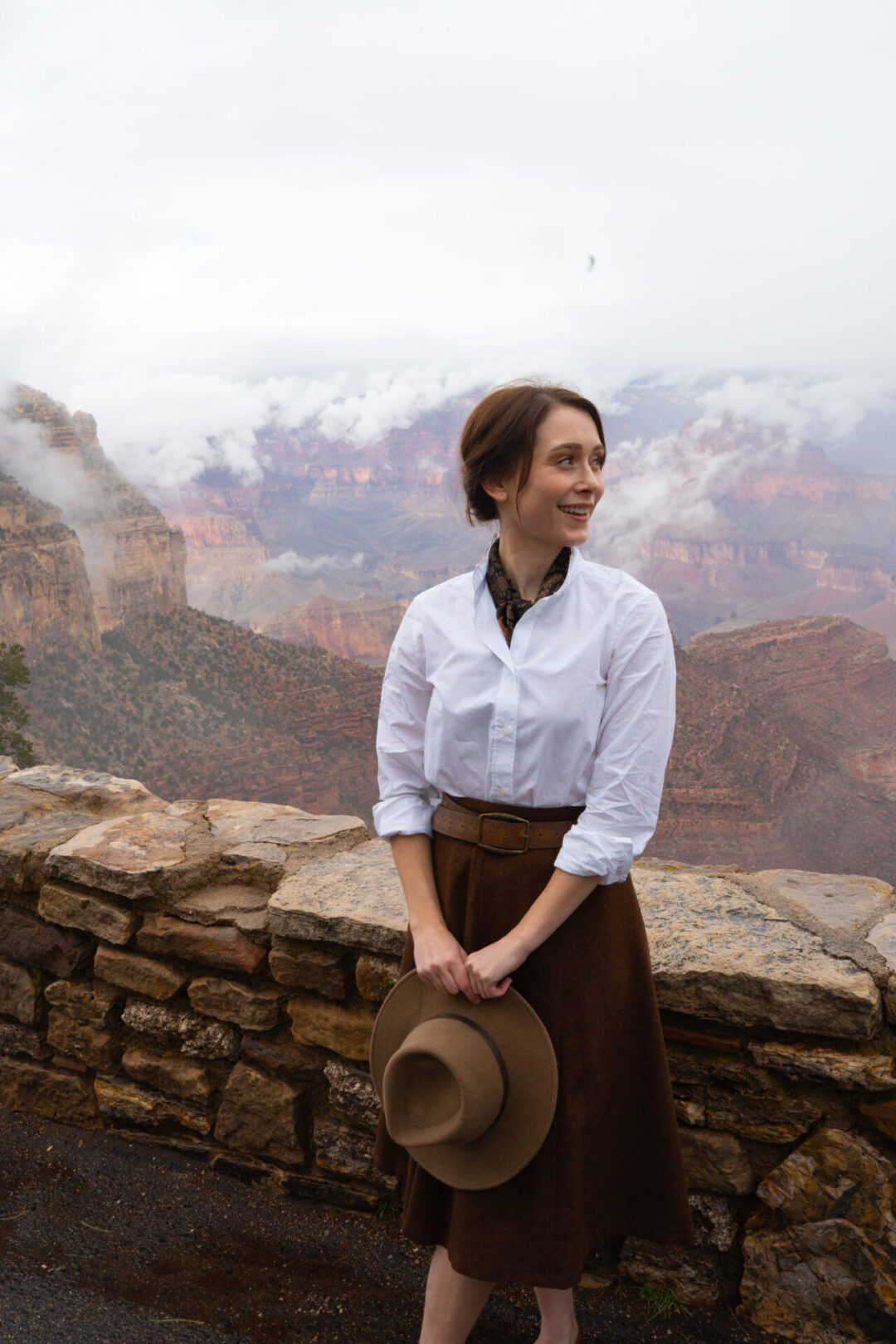 Travel Blogger Jordan Gassner smiling along Rim Trail of the Grand Canyon near El Tovar