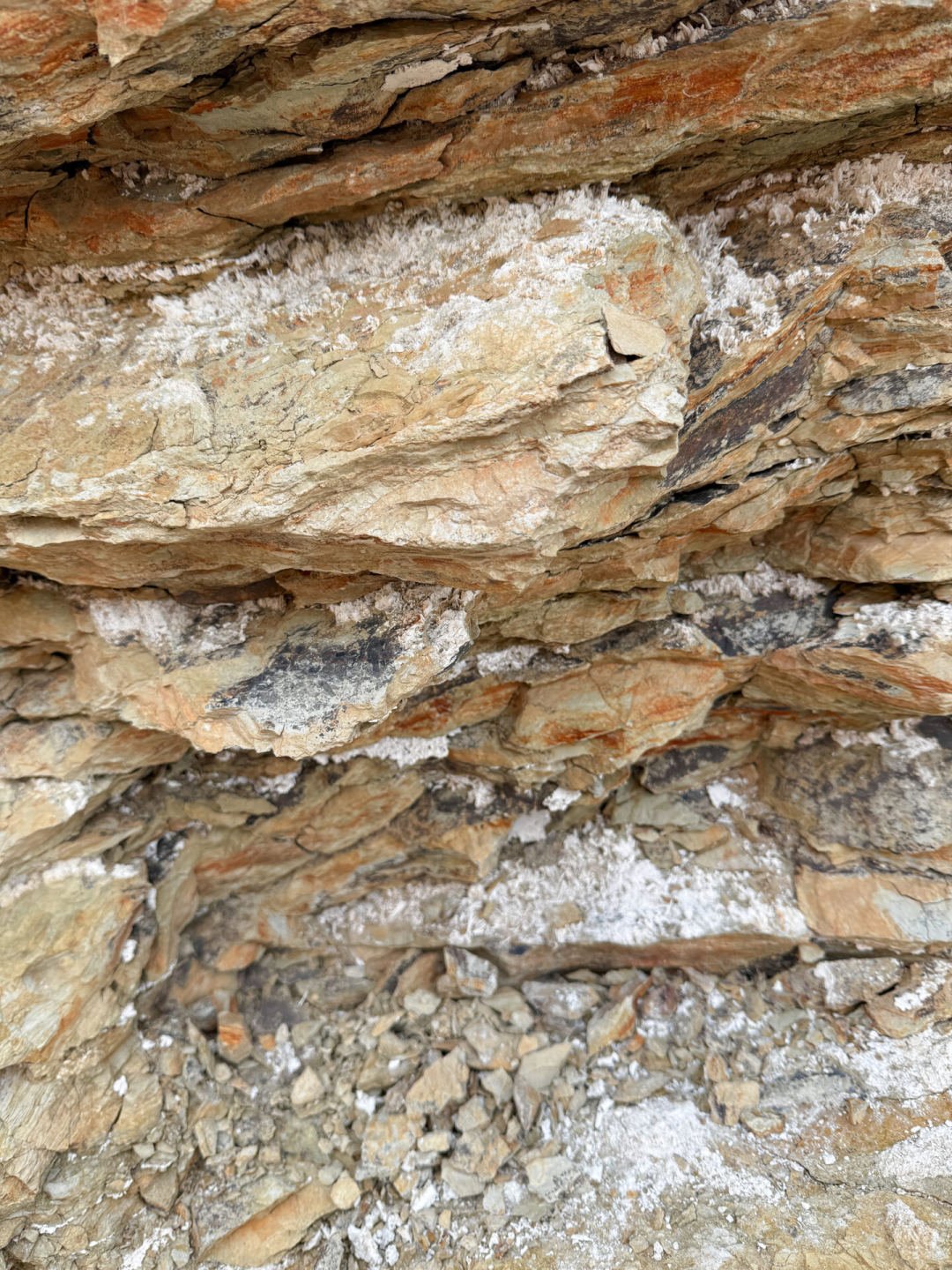 Salt fragments sitting on top of the rocks inside Golden Canyon in Death Valley, California