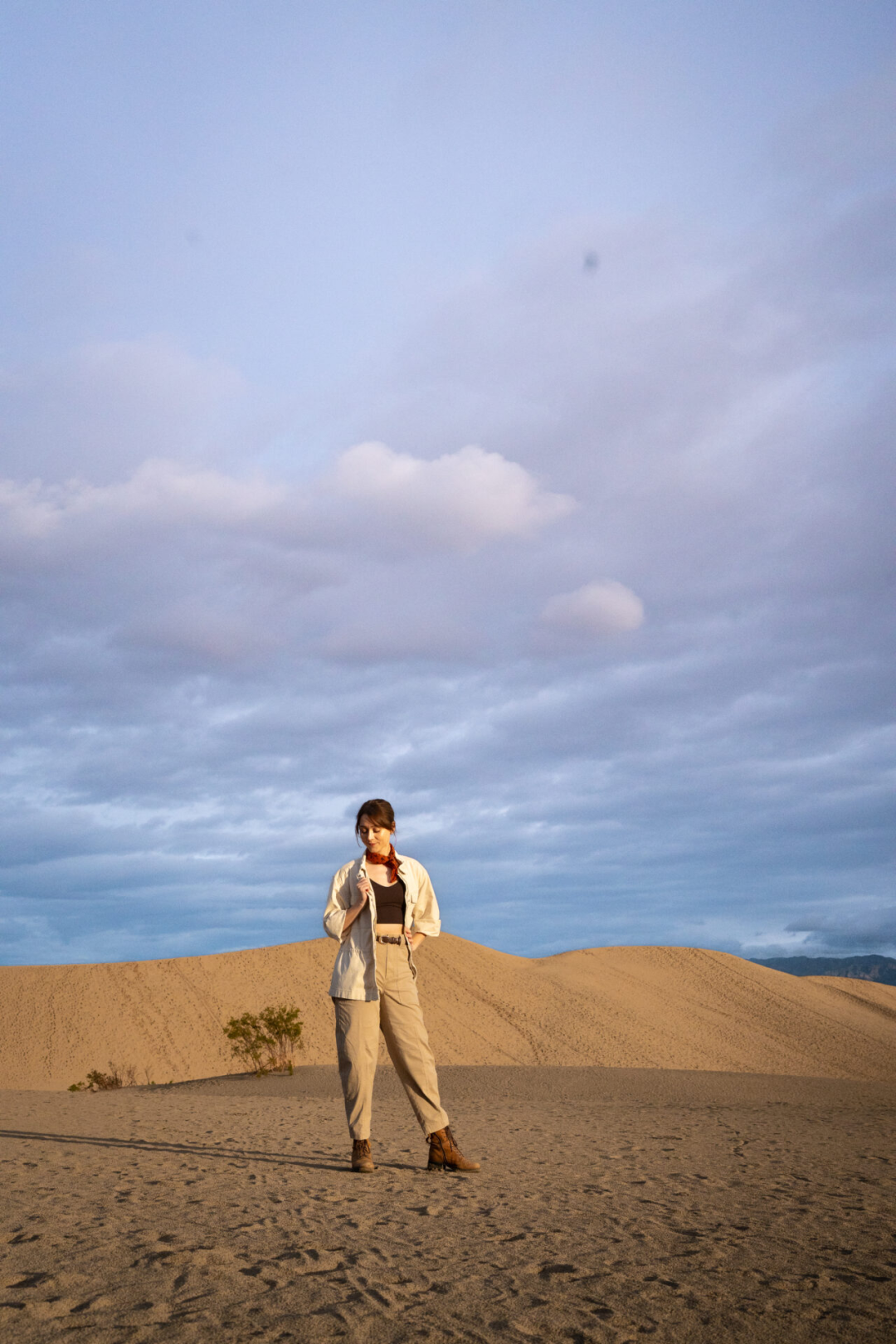 Travel Blogger Jordan Gassner standing on the sand in Mesquite Flat Sand Dunes in Death Valley National Park