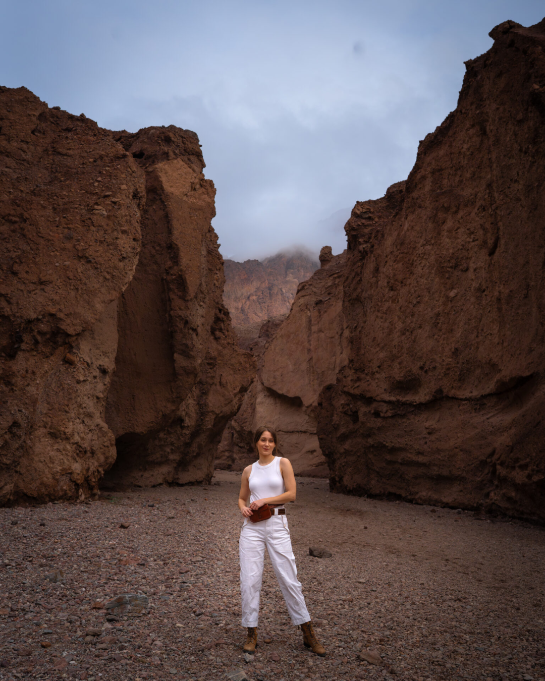 Travel Blogger Jordan Gassner standing in the middle of Natural Bridge Canyon in Death Valley National Park in California, USA
