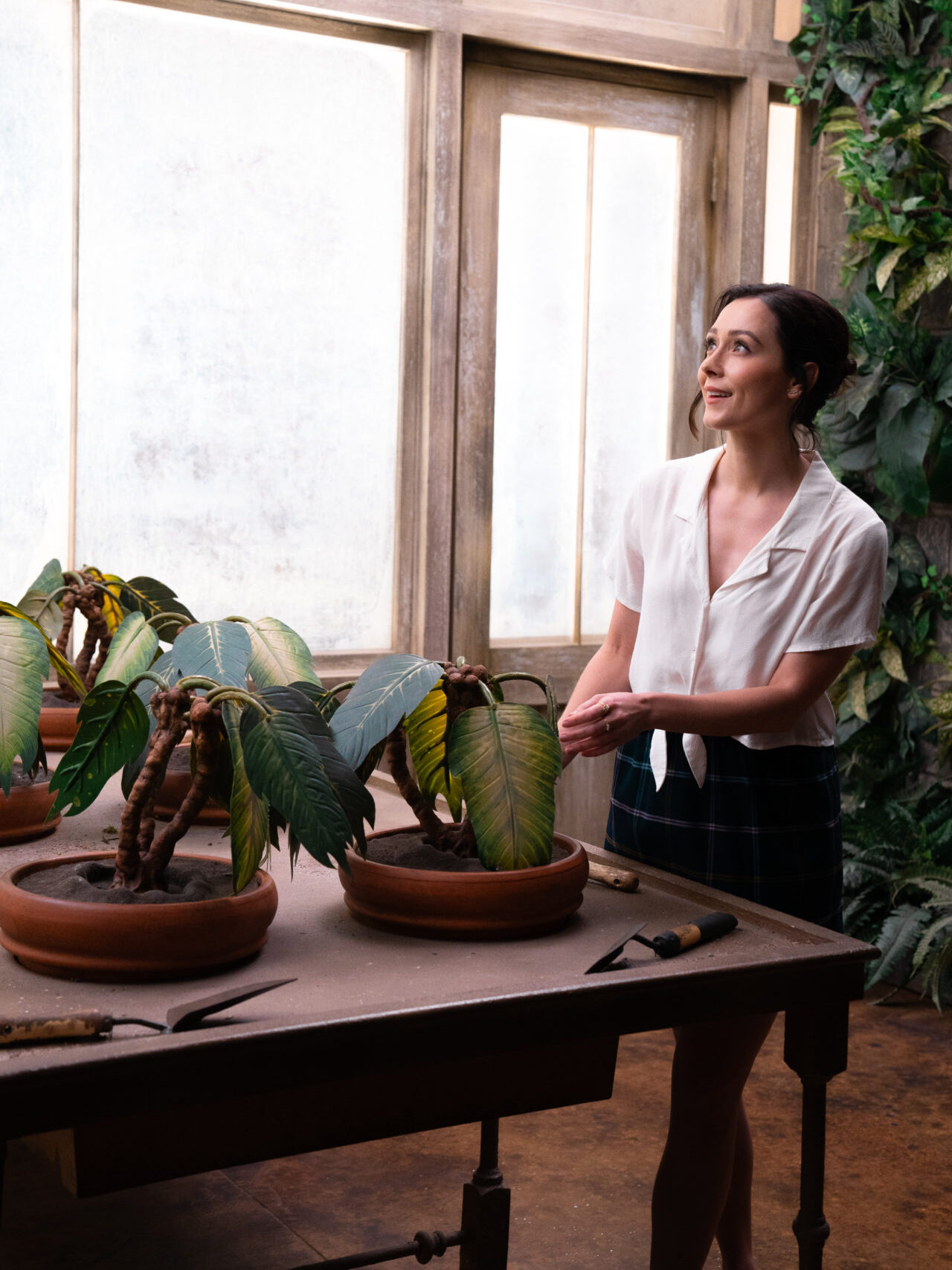Travel Blogger Jordan Gassner "potting a plant" inside an interactive Harry Potter set while on the Warner Bros. Studio Tour in Burbank, California, USA