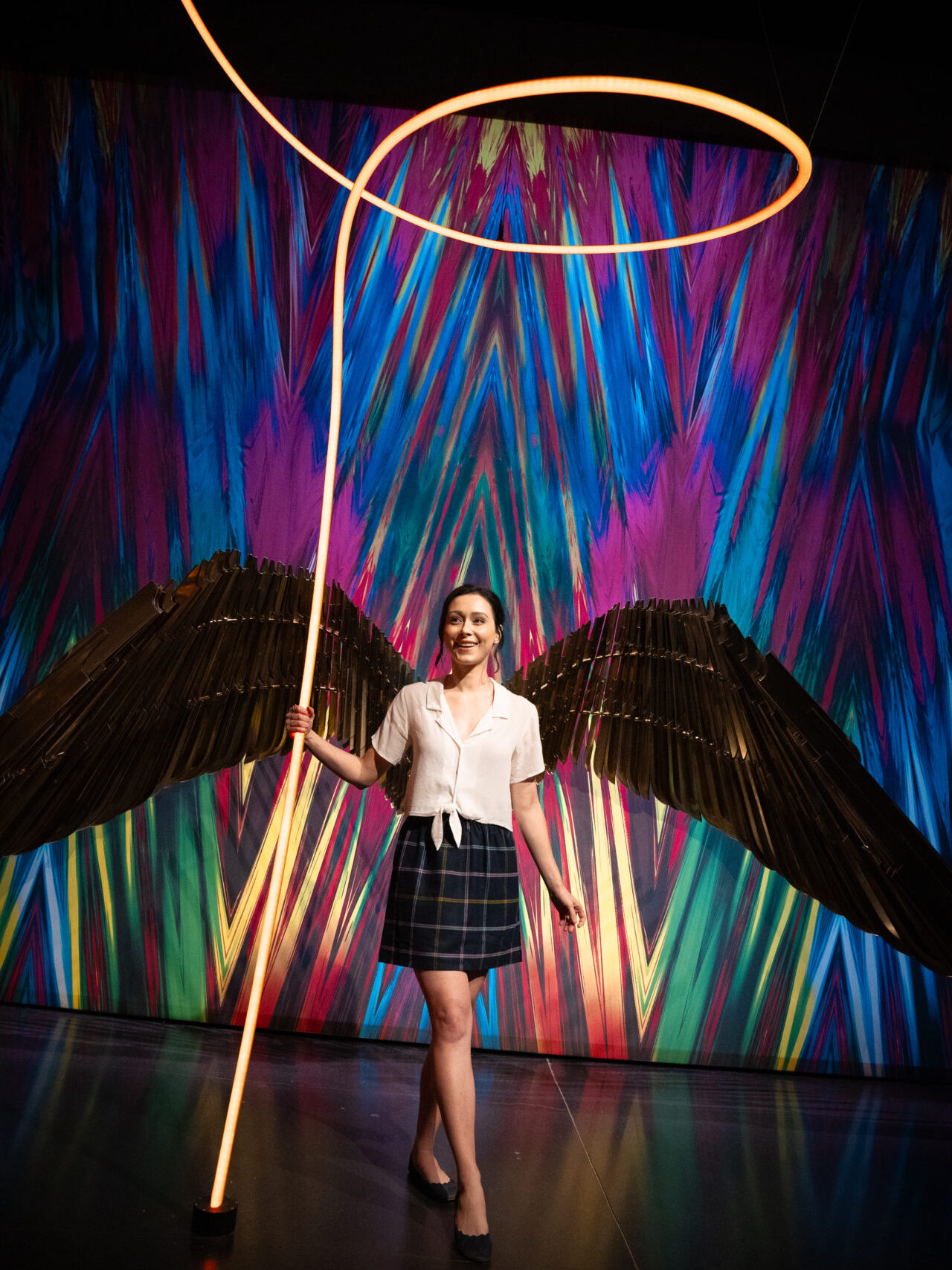 Travel Blogger Jordan Gassner holding a Wonder Woman Golden Lasso photo-op prop on the Warner Bros. Studio Tour in Burbank, California