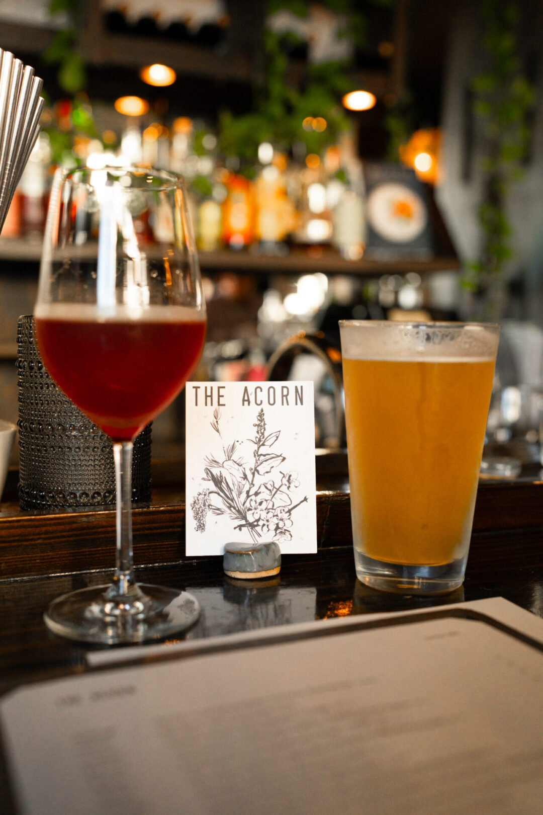 A glass of wine and mug of beer from The Acorn in Vancouver, Canada 