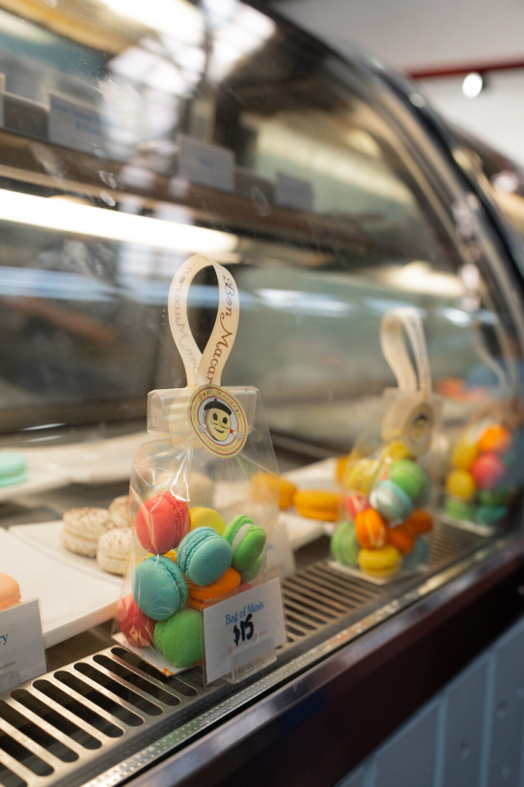 A display case with colorful macarons inside Bon Macron in Vancouver, Canada