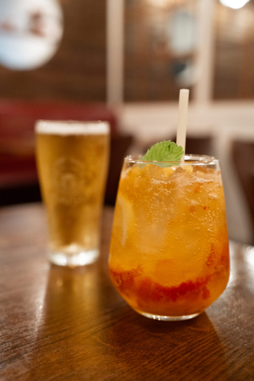 A Peach and Strawberry tonic and a beer from Raisu in Vancouver, Canada