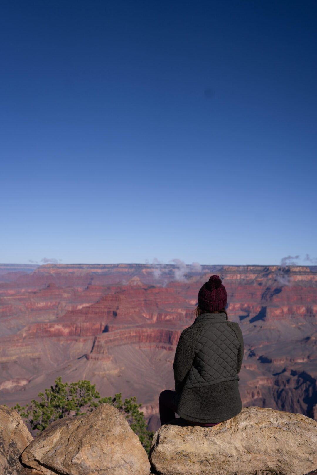 Travel Blogger Jordan Gassner looking out at Powell Viewpoint in the Grand Canyon
