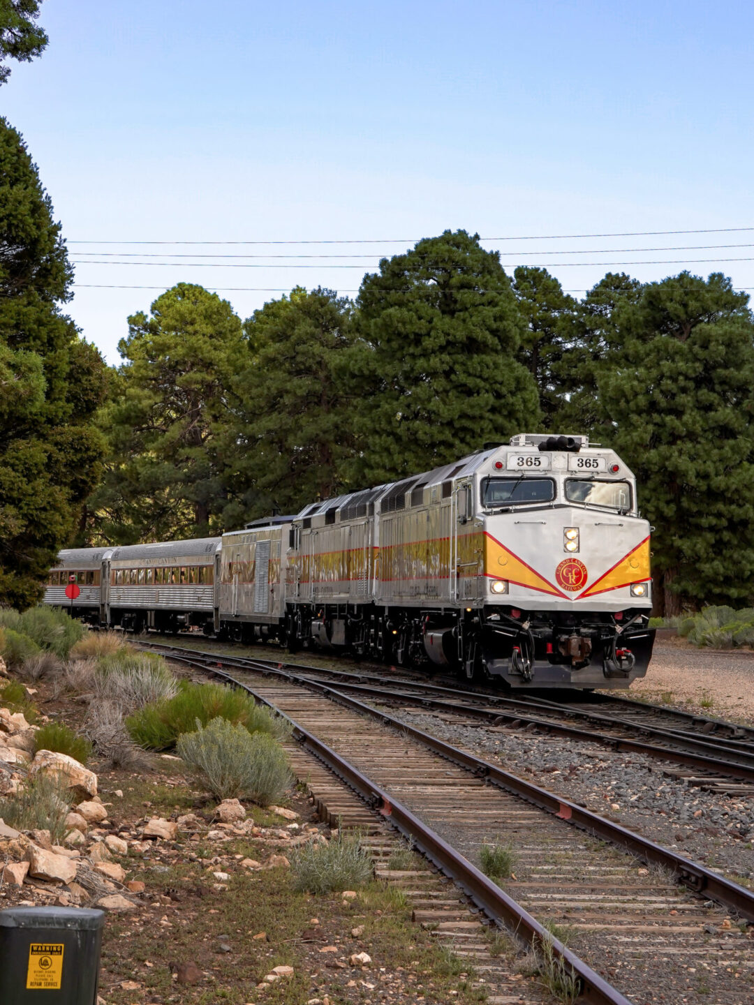 The Grand Canyon Railway coming down the a set of train tracks