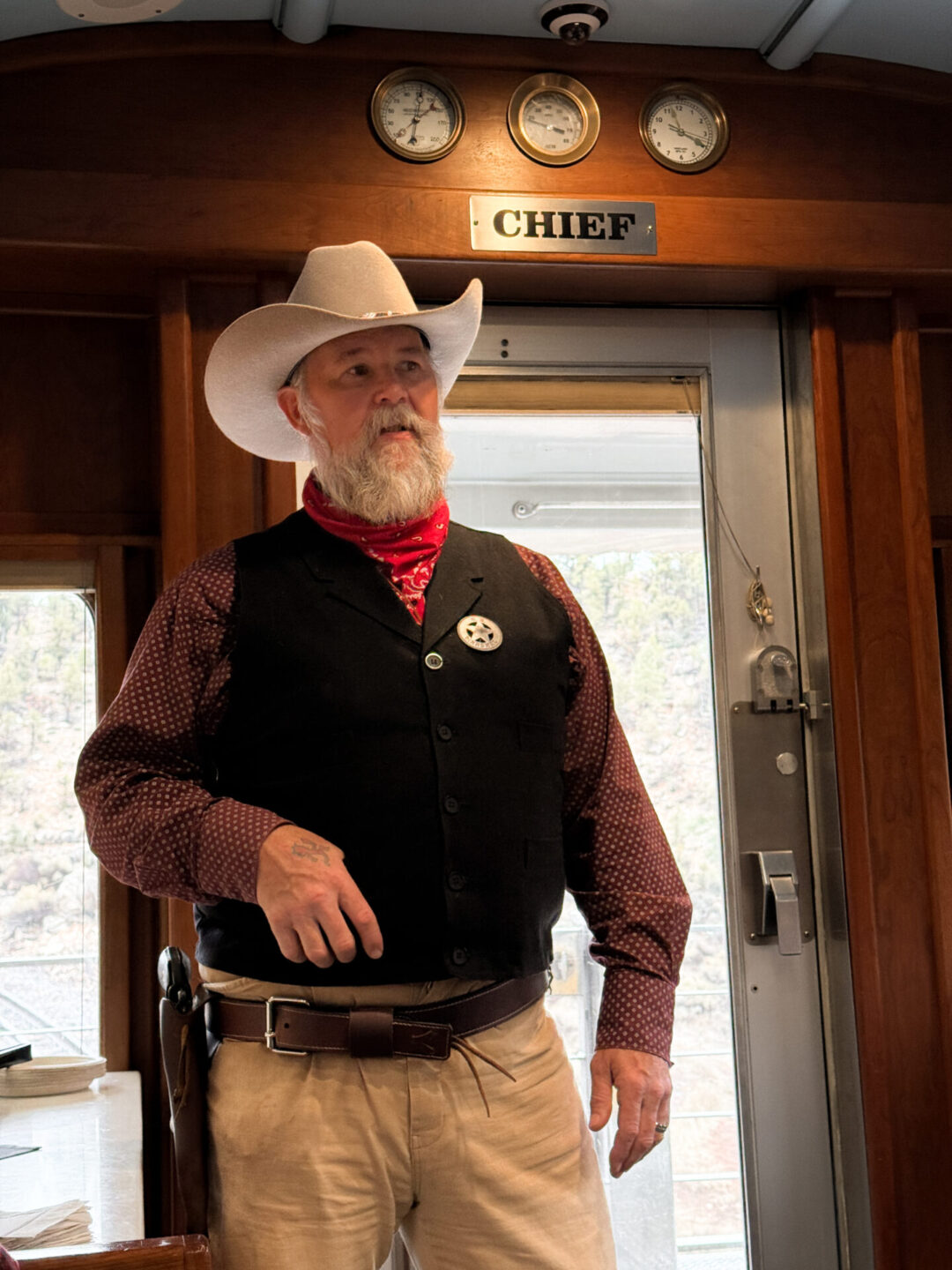 A "sheriff" inside the Chief car aboard the Grand Canyon Railway