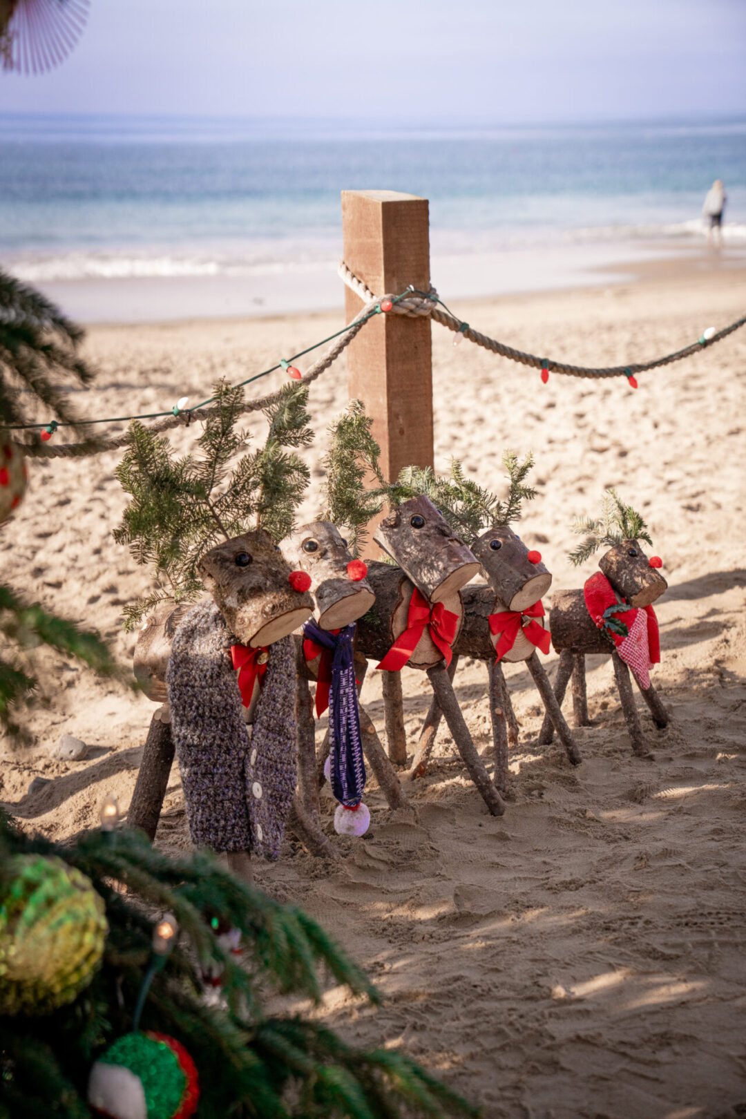 A set of wood-created reindeer along the beach in Crystal Cove, California