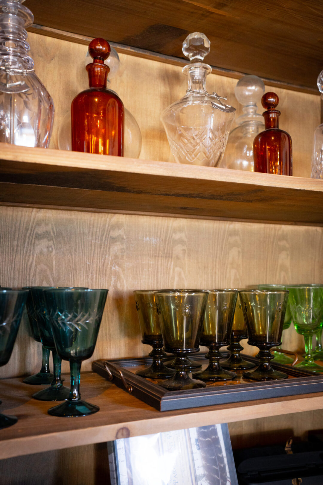 A shelf full of glasswear inside a shop at Crystal Cove Beach near Laguna Beach, California