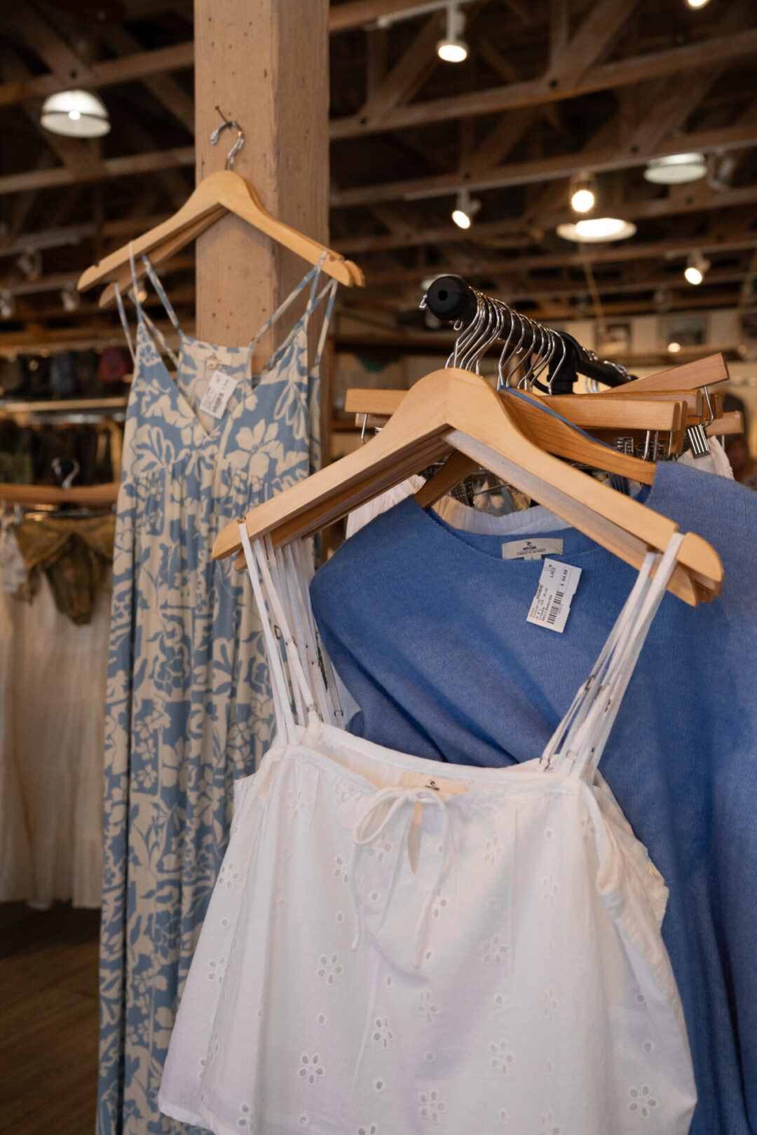 A few racks of women's clothing inside Hobie Surf Shop in Laguna Beach, California