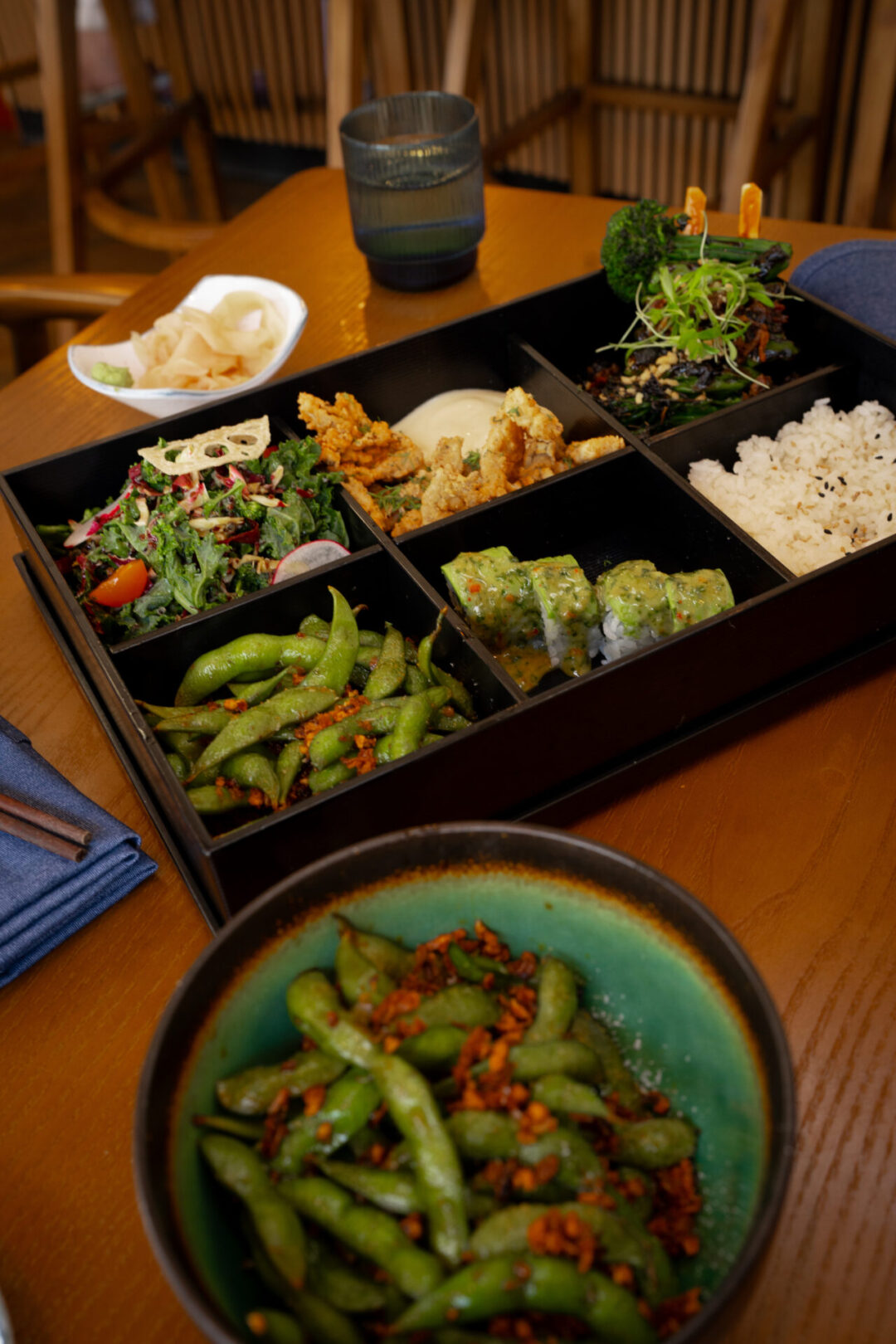 A spread of garlic edamame and a vegetarian bento box at Oto Sushi in Laguna Beach, California