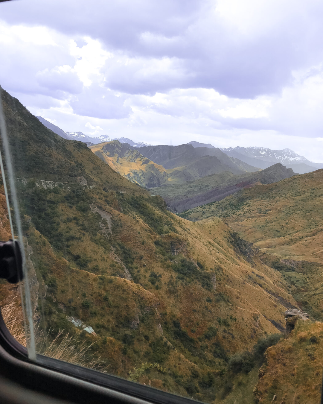 A look out a 4WD vehicle traversing Skippers Canyon Road in Queenstown, New Zealand