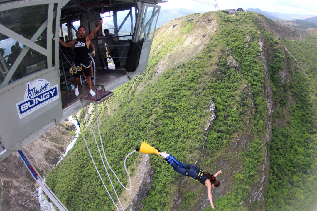 Travel Blogger Jordan Gassner jumping from the Nevis Bungy Jump platform in Queenstown, New Zealand