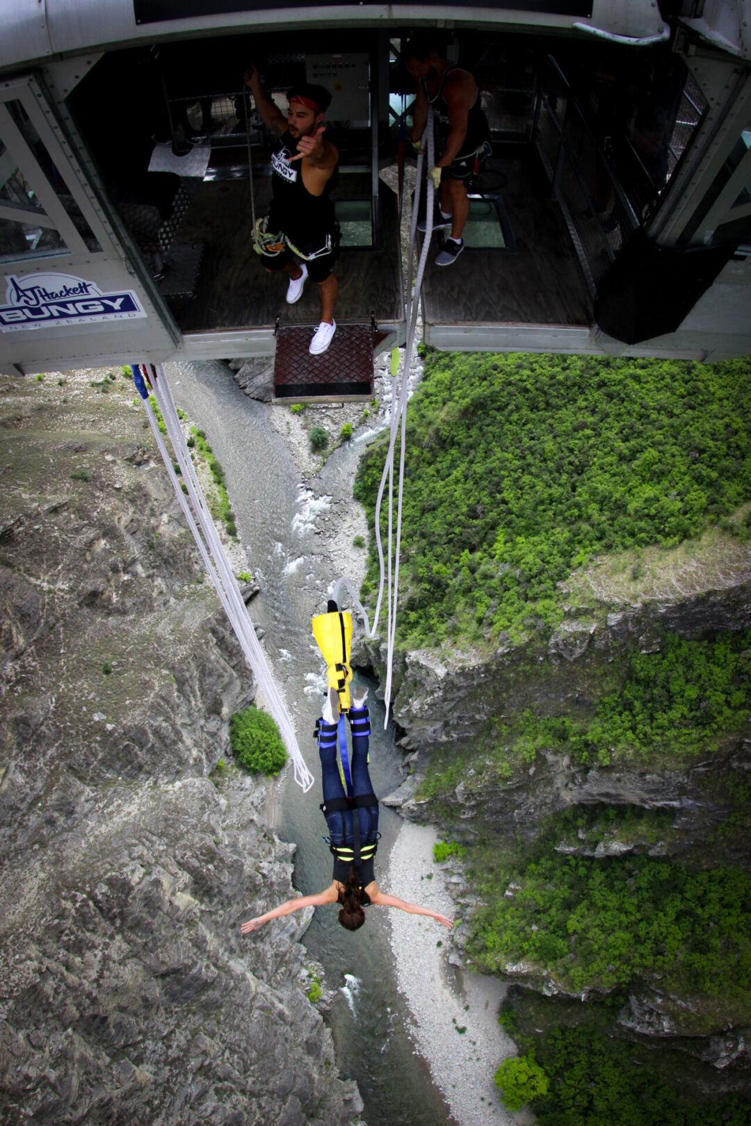 Travel Blogger Jordan Gassner bungy jumping out over the Nevis River Gorge in Queenstown, New Zealand