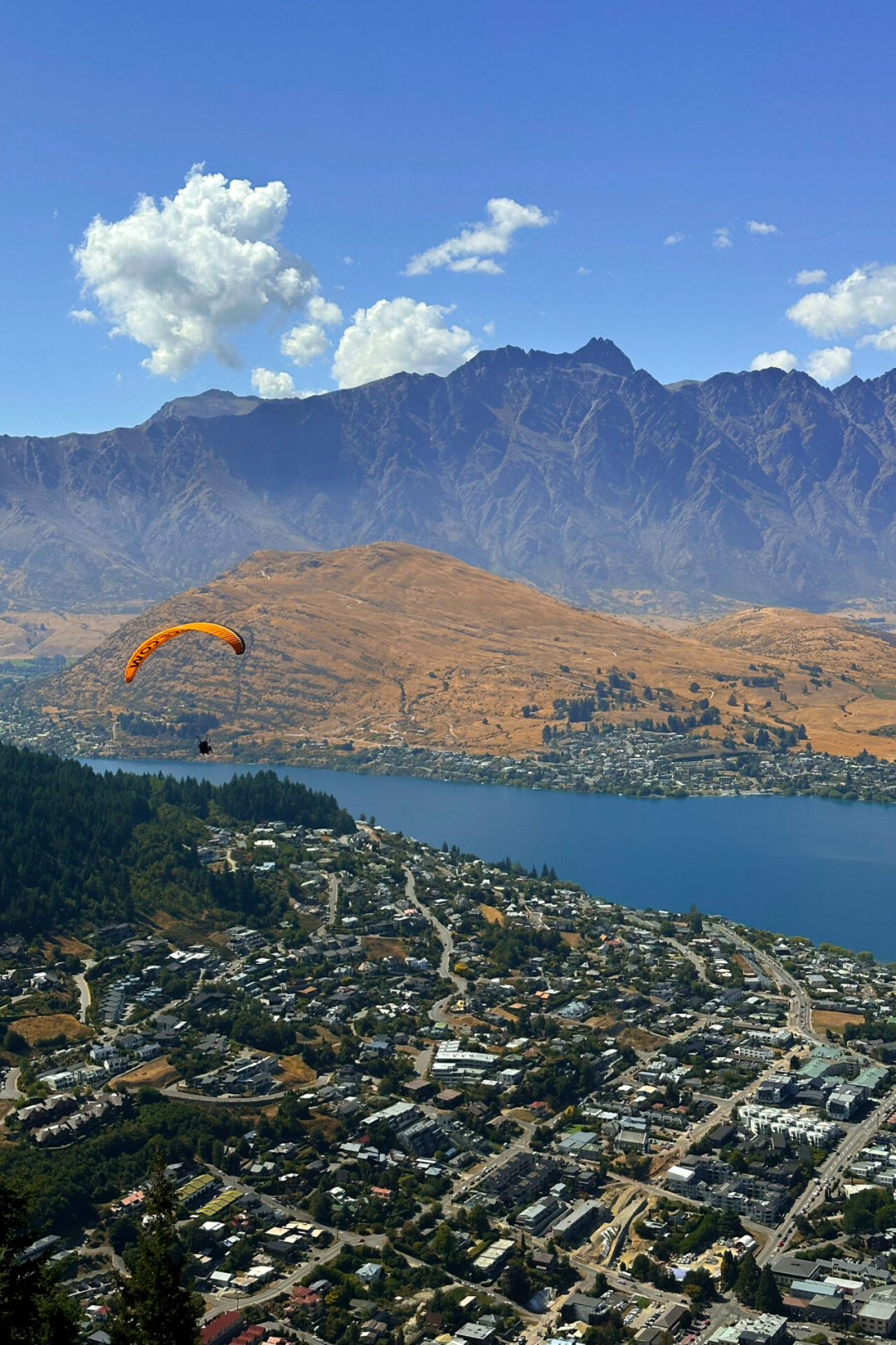 A sky diver parachuting over Queenstown, New Zealand
